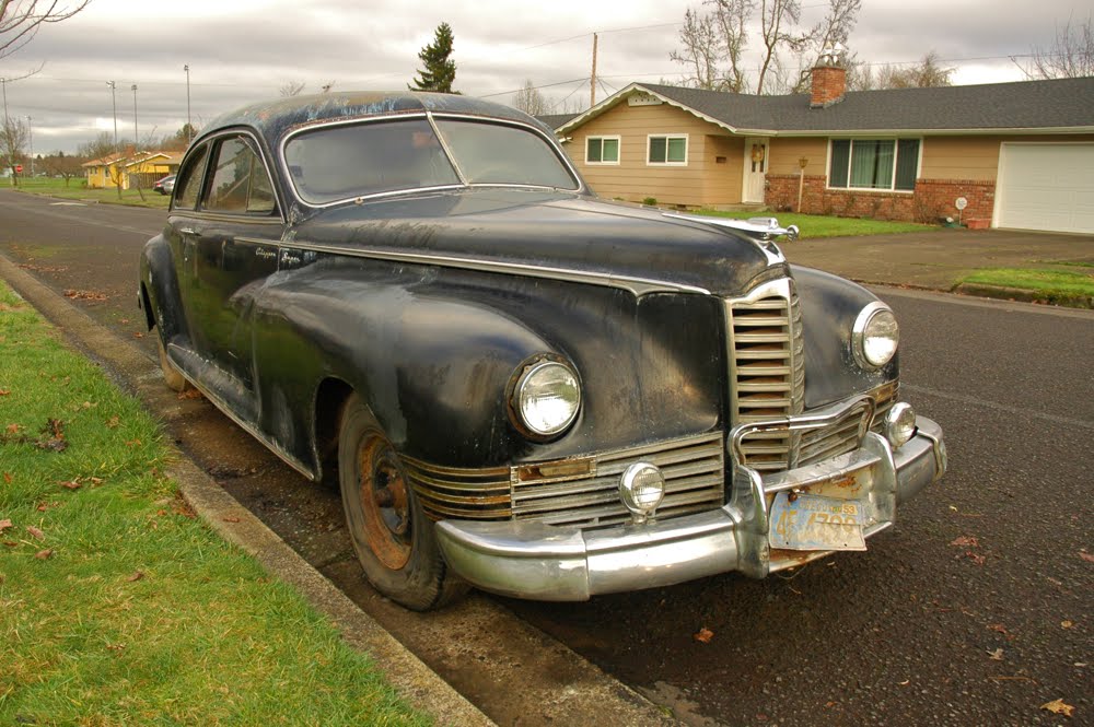 OLD PARKED CARS.: 1947 Packard Clipper Super Coupe.