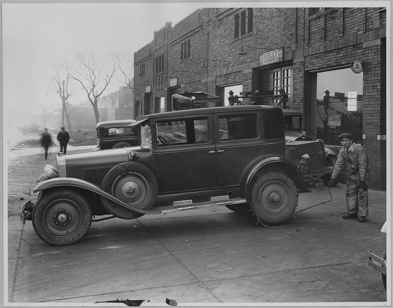 File:LaSalle sedan with chain on rear wheel, at garage. Omaha ...