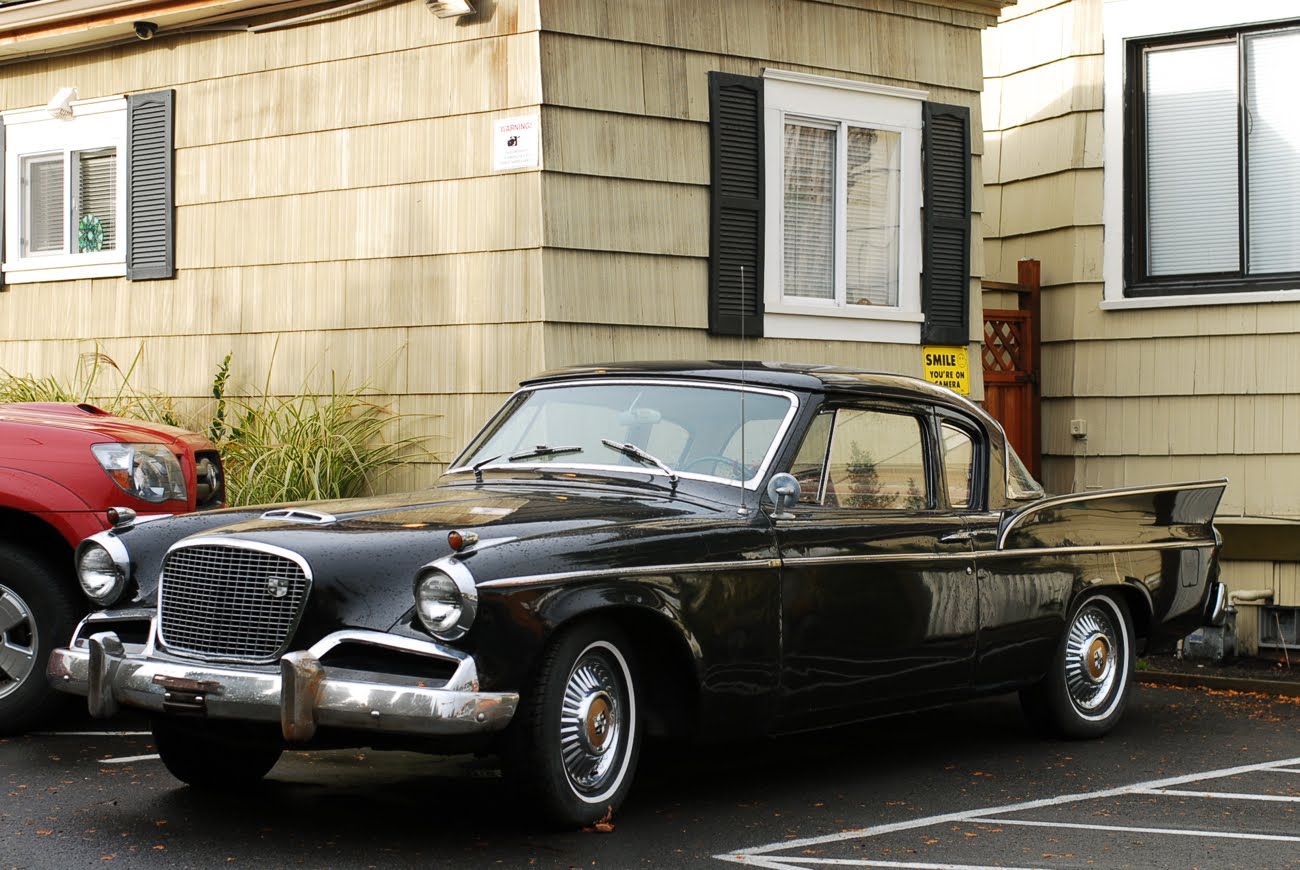 OLD PARKED CARS.: 1957 Studebaker Silver Hawk.