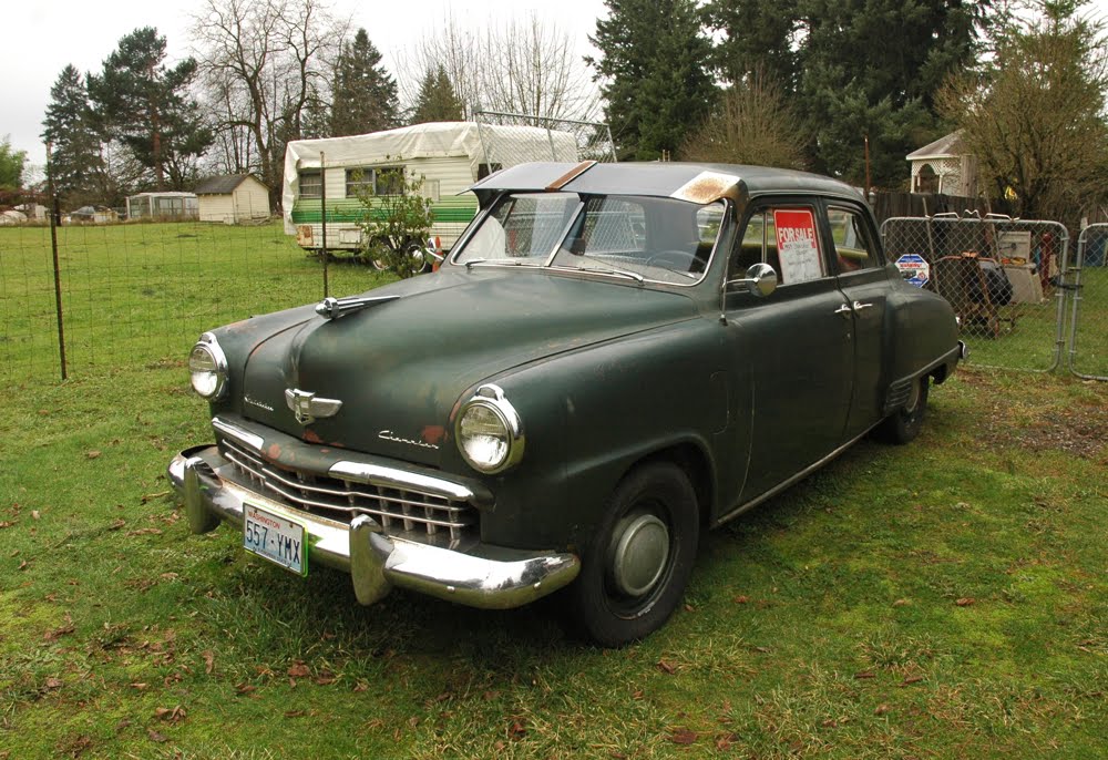 OLD PARKED CARS.: 1949 Studebaker Champion.