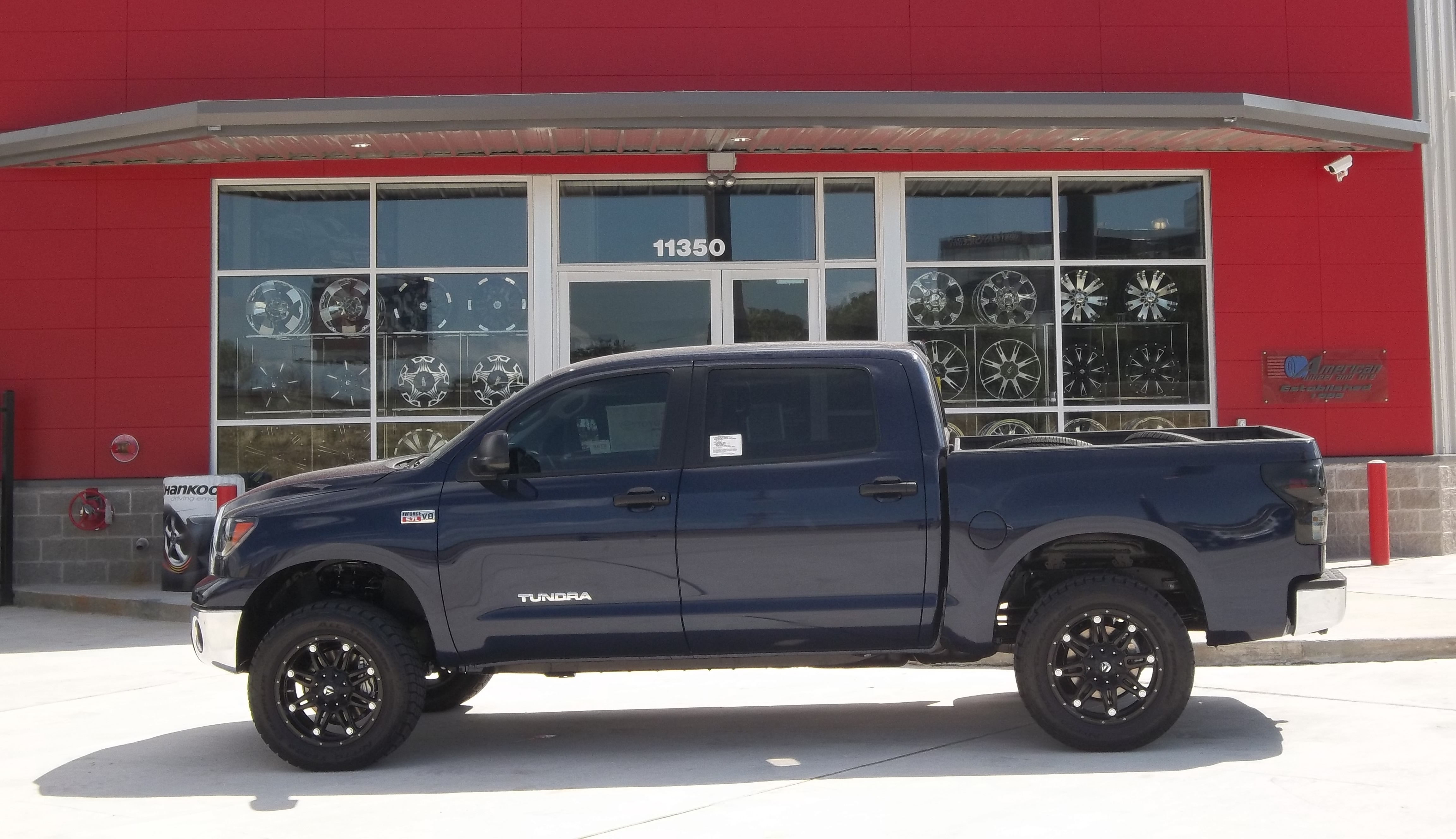 20 inch Fuel Hostage rims in a 2012 4Ã—4 Toyota Tundra with 305 55R20 Nitto