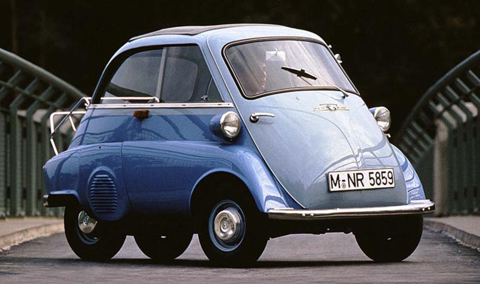 This is an Isetta. It was a car made by BMW. It is not a motorcycle.