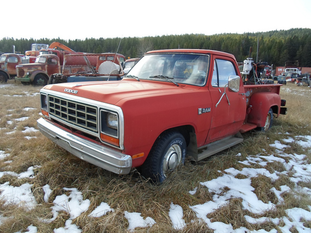 An 80s Dodge D-series pickup truck with an earlier sideside box.