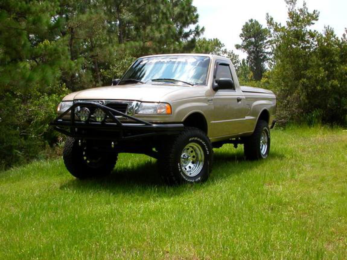 It's a 2WD 2000 Mazda B2500. The front bumper was made by sterling equipment
