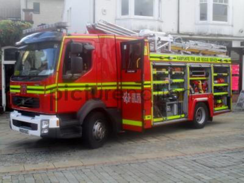 Volvo fire engine parked in the High St , Andover , Hampshire , England .