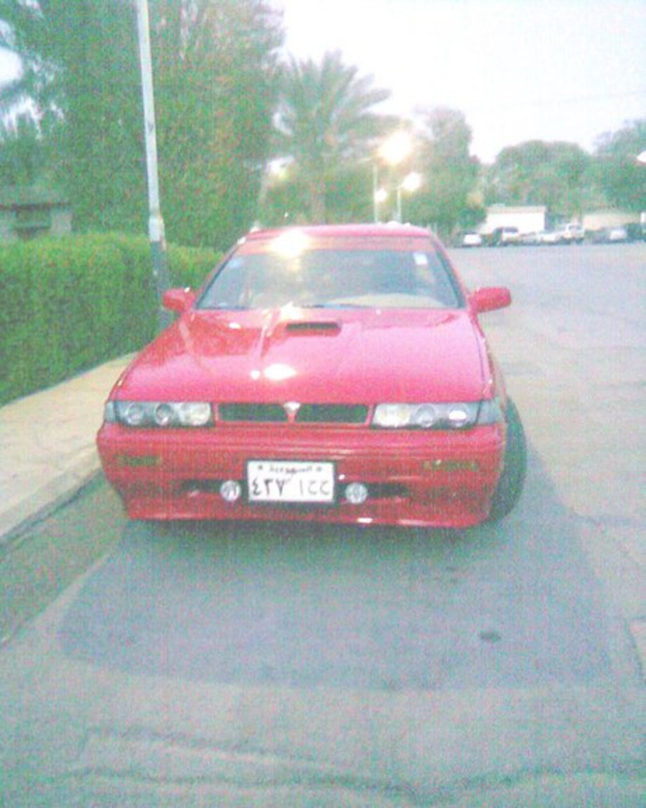 side view red nissan laurel altima w/ alloy spoilers