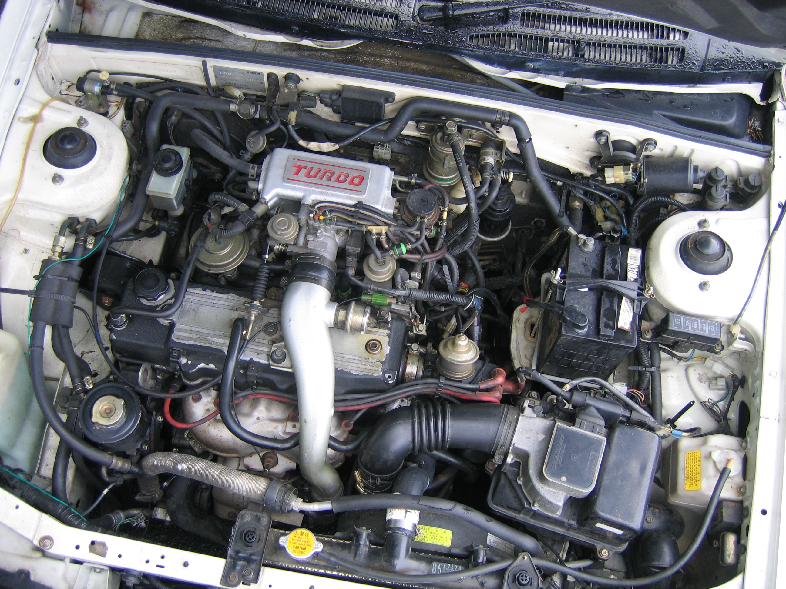 File:Mazda E5T engine of a 1986 Mazda Familia (BF5P) XG turbo sedan