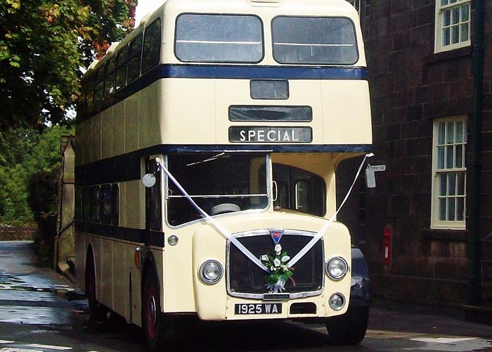 Classic limousine; vintage Bridgemaster double decker bus