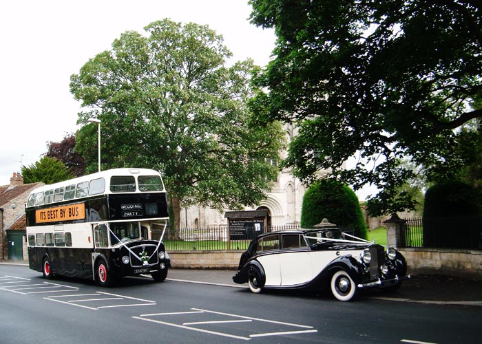 The classic limousine is a vintage double decker bus.