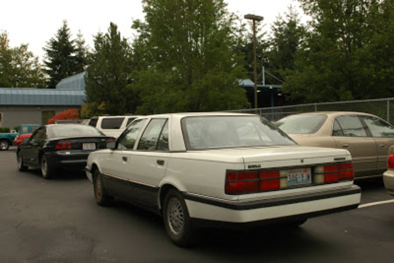 OLD PARKED CARS.: 1988 Eagle Premier LX.