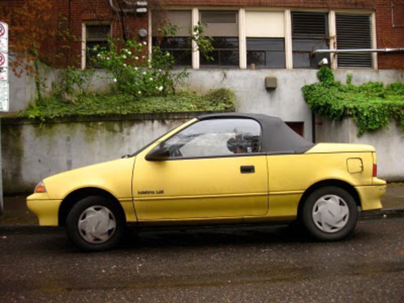 OLD PARKED CARS.: 1990 Geo Metro LSi Convertible.