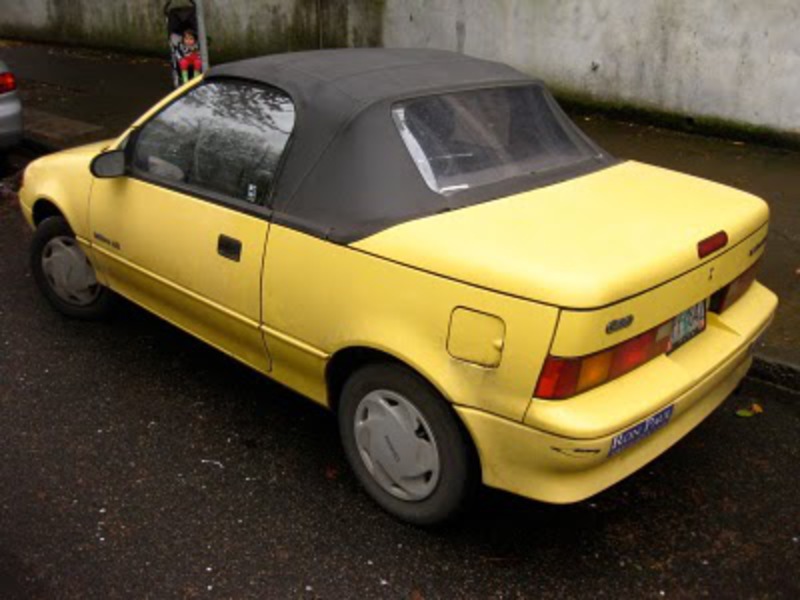 OLD PARKED CARS.: 1990 Geo Metro LSi Convertible.