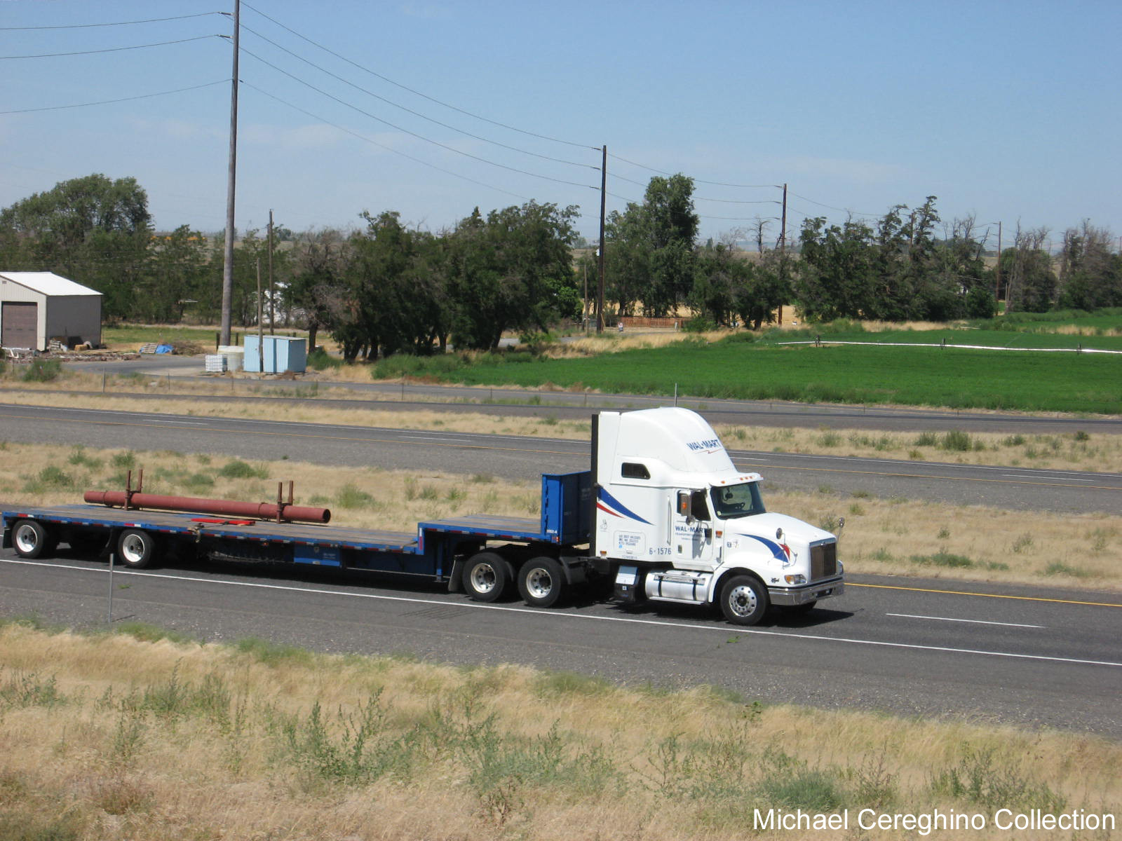 Wal-Mart International 9400 pulling a Stepdeck trailer belonging ...
