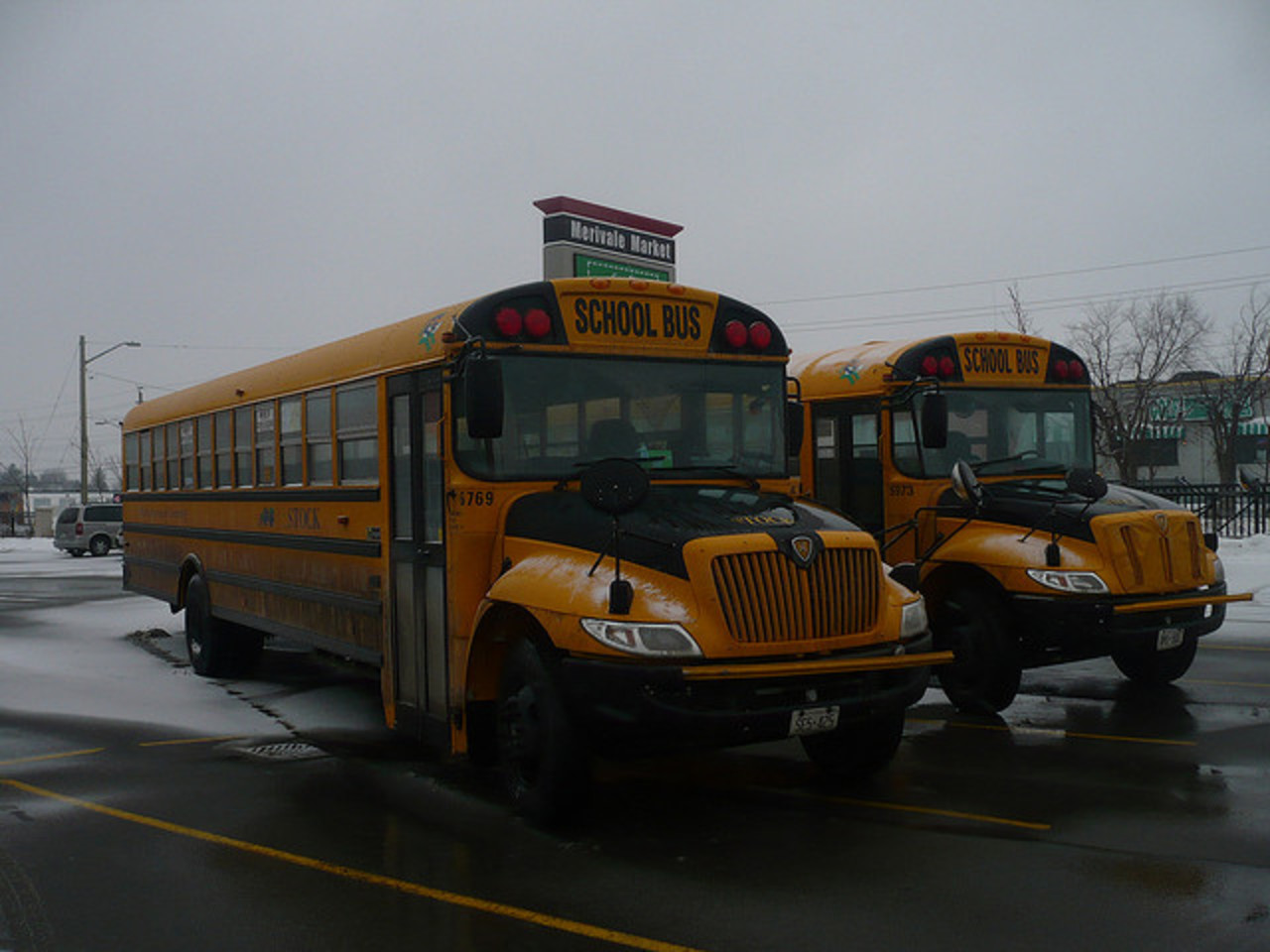 A pair of school buses (International 3300 school bus chassis ...