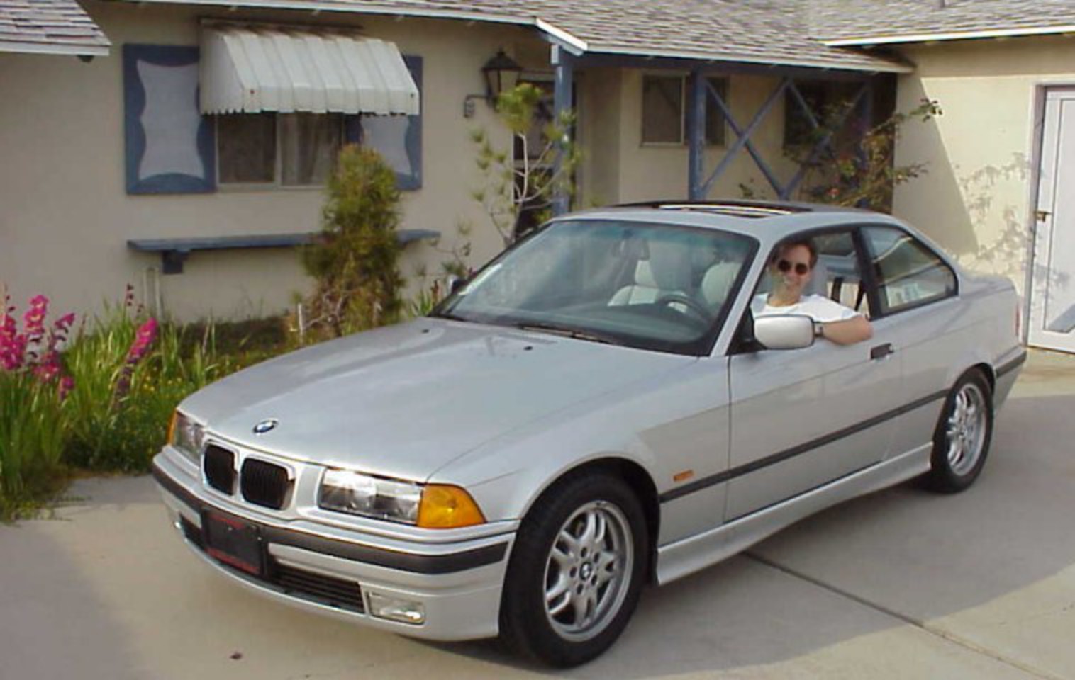 Me in the 1999 BMW 323is I used to have in front of my house.